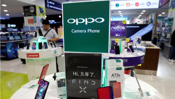 Oppo smartphones are displayed in a shop in Singapore
