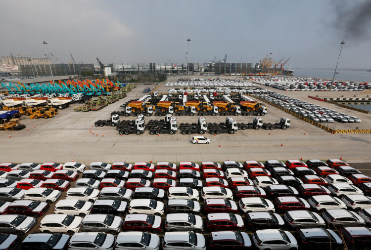 New cars wait to be loaded onto cargo ships for export at the Tanjung Priok Car Terminal in Jakarta