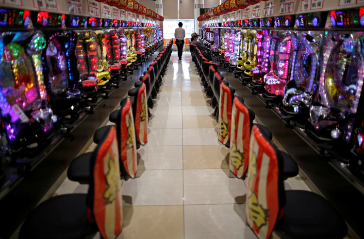 Visitors play pachinko, a Japanese form of legal gambling, at a pachinko parlour in Fukushima