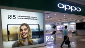 A man passes by an Oppo shop in Singapore