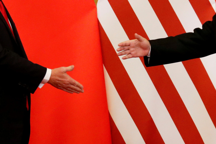 U.S. President Donald Trump and China's President Xi Jinping shake hands