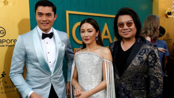 Author Kwan and cast members Golding and Wu pose at the premiere for 