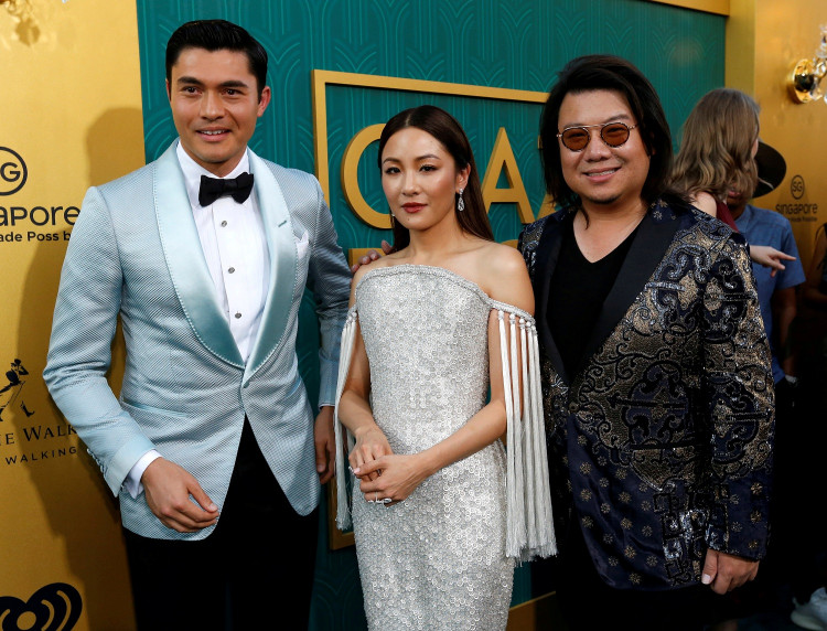 Author Kwan and cast members Golding and Wu pose at the premiere for "Crazy Rich Asians" in Los Angeles.