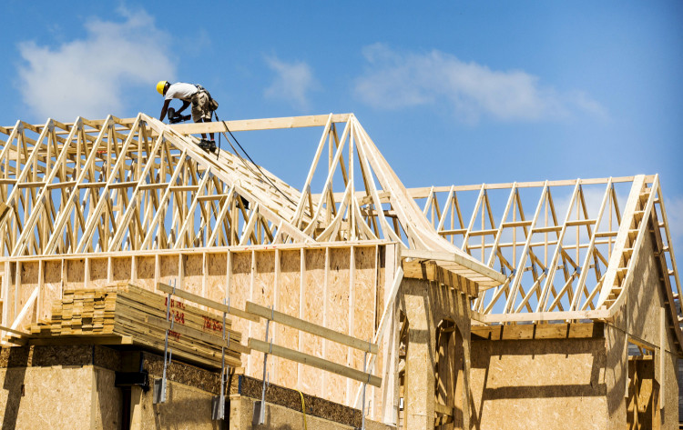 A construction worker works on a new house being built in Vaughan