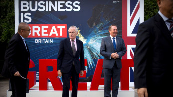 Richard Burn, British Trade Commissioner for China and British Secretary of State for International Trade Liam Fox 