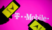 Sprint logo on phones in front of T-Mobile logo on screen
