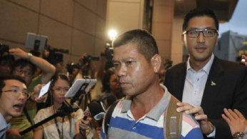 CCTV Shows Man with Cleaver Before He Threatened Hong Kong Judge