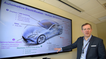 Eby, vice president of 3MÕs automotive electrification program shows off a number of product areas in St. Paul