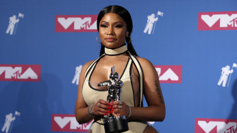 Nicki Minaj shared the cover of Eminem's new album, 'Kamikaze,' and addressed him as her husband on Instagram. 