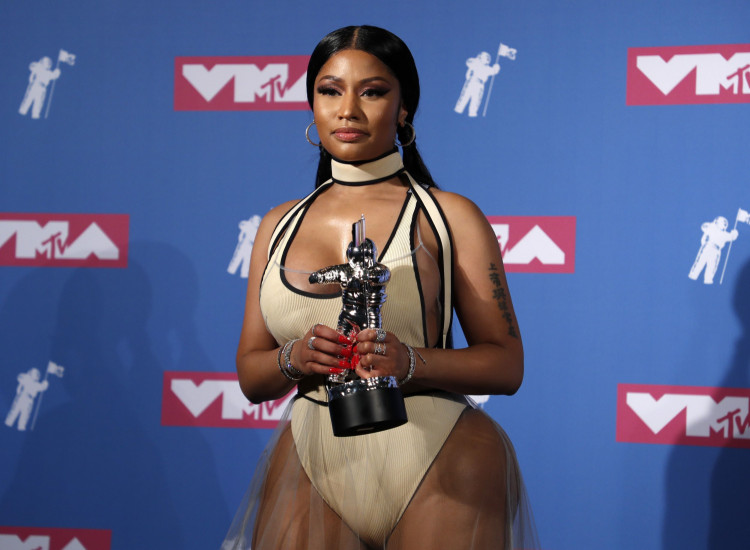 Nicki Minaj shared the cover of Eminem's new album, 'Kamikaze,' and addressed him as her husband on Instagram. 