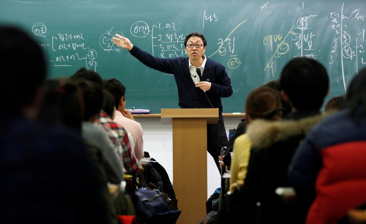 A teacher gives a lecture at a cram school in a Goshichon in Seoul