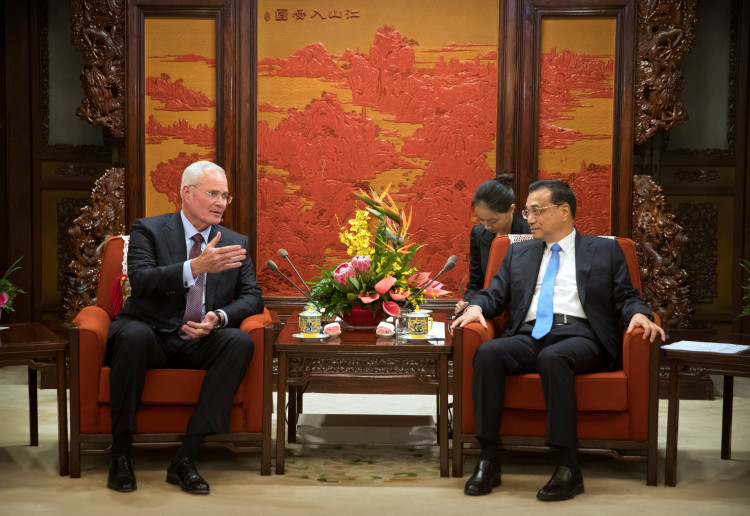 Exxon Mobil CEO Darren Woods and Chinese Premier Li Keqiang