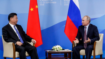 Russian President Putin speaks with Chinese President Xi Jinping