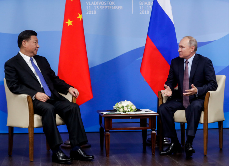 Russian President Putin speaks with Chinese President Xi Jinping
