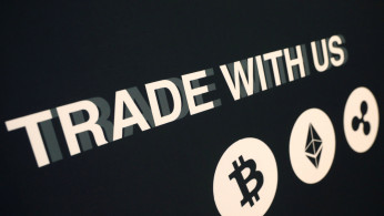 A message on a vendor's booth is seen on display at the Consensus 2018 blockchain technology conference in New York City