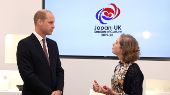 Britain's Prince William talks to Rebecca Simor, Director, Festivals and Seasons at the British Council, at the official opening of Japan House in London