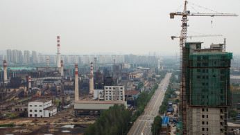 The decommissioned Guofeng Iron and Steel plant and an apartment building