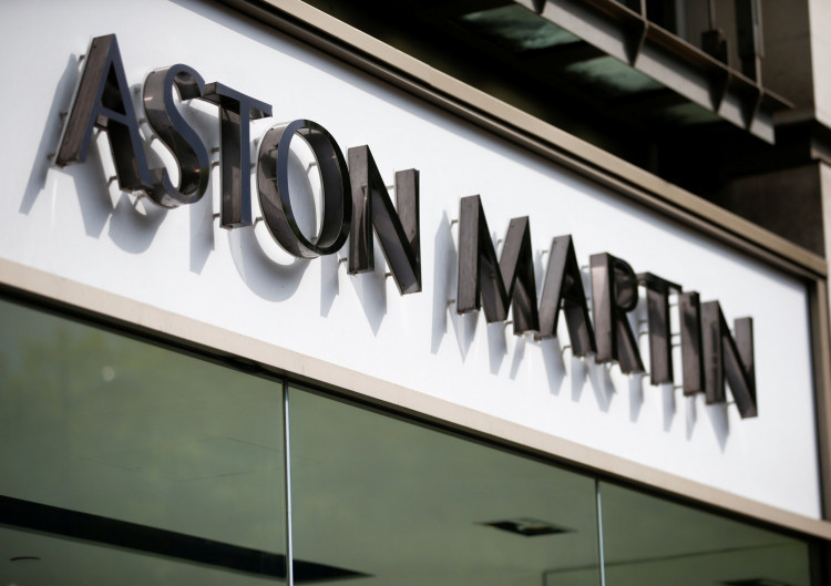 An Aston Martin logo is seen on the outside of a dealership in central London