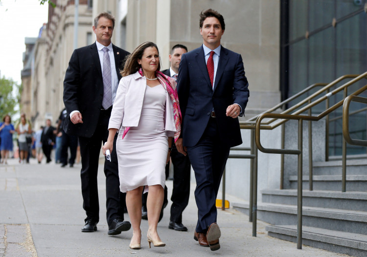 Canada's PM Trudeau walks to a news conference with Foreign Minister Freeland