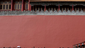 Tourists wait to visit the Forbidden City in central Beijing, China