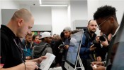 An employee works during the launch of the new iPhone XS and XS Max sales at a shop in Moscow