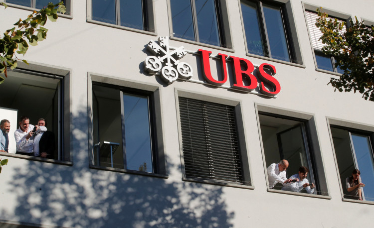 Employees of Swiss bank UBS take pictures as actor Depp leaves during the 14th Zurich Film Festival in Zurich