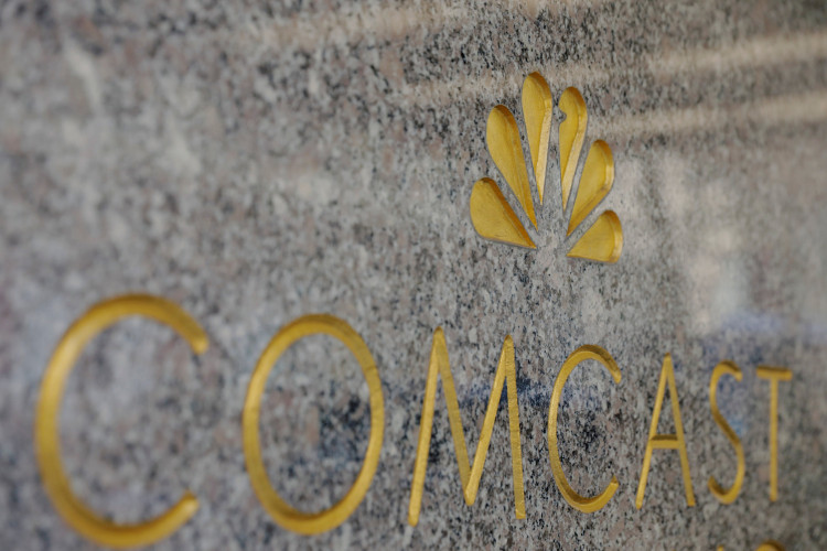 NBC and Comcast logos are displayed on 30 Rockefeller Plaza in midtown Manhattan in New York