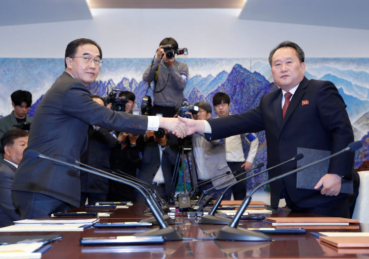 North Korea's Ri Son Gwon shakes hands with South Korean Unification Minister Cho 