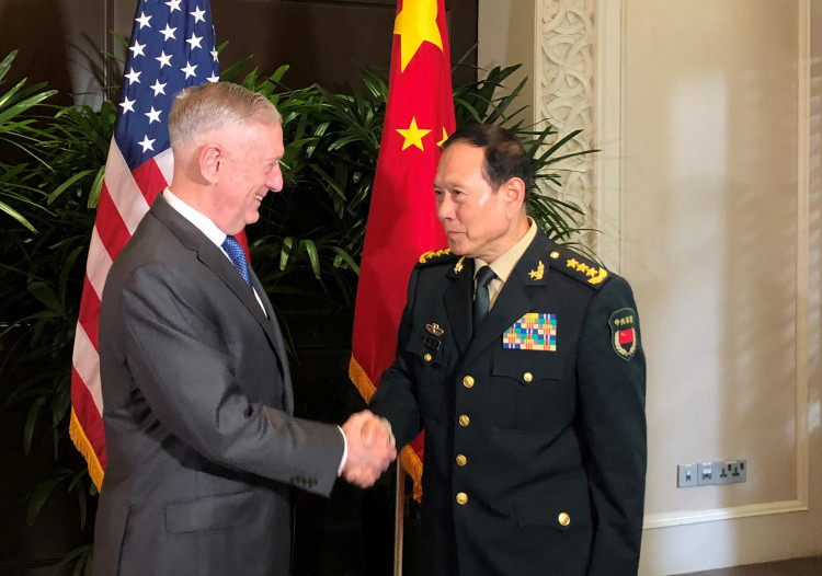 U.S. Defense Secretary Jim Mattis and China's Defense Minister Wei Fenghe greet each other ahead of talks in Singapore