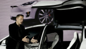 Tesla Motors CEO Elon Musk introduces the falcon wing door on the Model X electric sports-utility vehicles during a presentation in Fremont