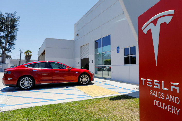 A Tesla sales and service center is shown in Costa Mesa, California