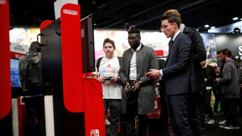 Visitors play Super Smash Bros Ultimate on Nintendo Switch at the Paris Games Week (PGW), a trade fair for video games in Paris