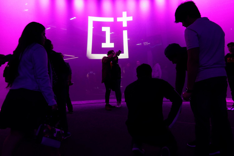 The OnePlus logo is projected onto a wall during a launch event for the new OnePlus 6T in the Manhattan borough of New York