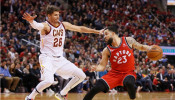 Toronto Raptors guard Fred VanVleet (23) tries to drive around Cleveland Cavaliers guard Kyle Korver (26)