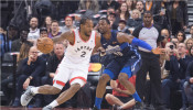Toronto Raptors forward Kawhi Leonard (2) controls a ball as Dallas Mavericks forward Dorian Finney-Smith (10) tries to defend at Scotiabank Arena. 