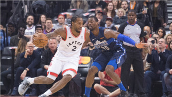 Toronto Raptors forward Kawhi Leonard (2) controls a ball as Dallas Mavericks forward Dorian Finney-Smith (10) tries to defend at Scotiabank Arena. 