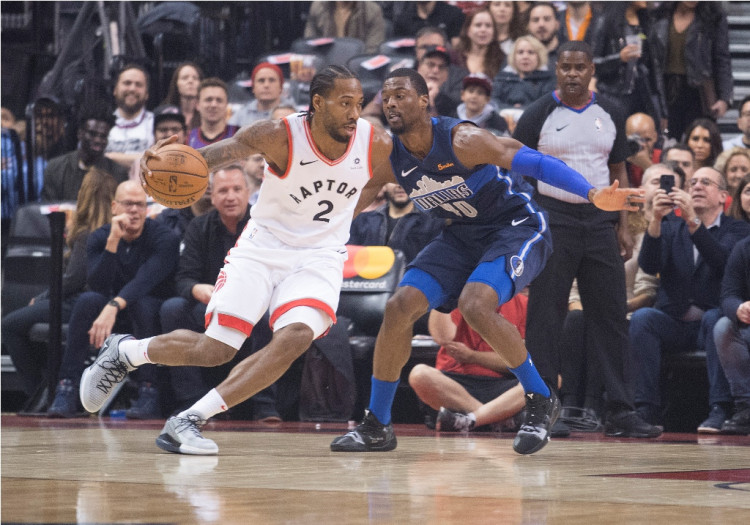 Toronto Raptors forward Kawhi Leonard (2) controls a ball as Dallas Mavericks forward Dorian Finney-Smith (10) tries to defend at Scotiabank Arena. 