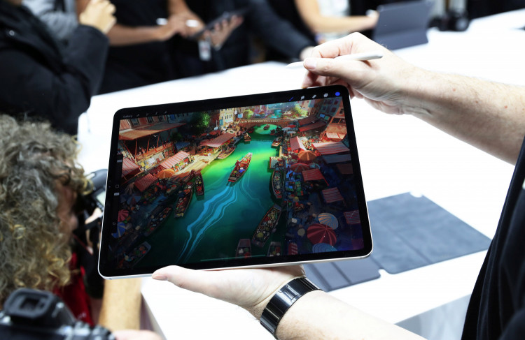 Attendees try out the new iPad Pro during an Apple launch event in the Brooklyn borough of New York