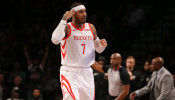Houston Rockets forward Carmelo Anthony (7) celebrates after a three point shot against the Brooklyn Nets during the fourth quarter at Barclays Center.