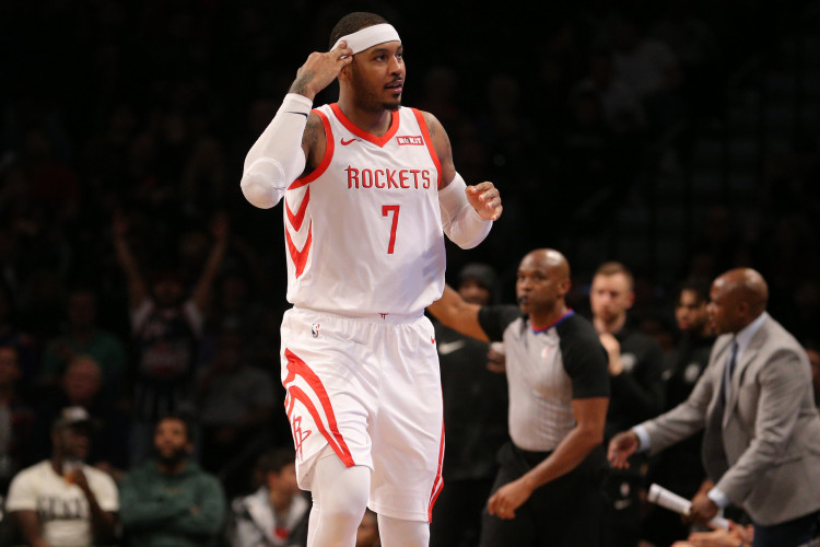 Houston Rockets forward Carmelo Anthony (7) celebrates after a three point shot against the Brooklyn Nets during the fourth quarter at Barclays Center.