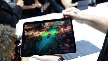 Attendees try out the new iPad Pro during an Apple launch event in the Brooklyn borough of New York