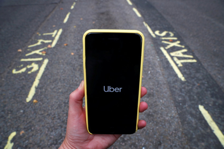 The Uber application is seen on a mobile phone in London