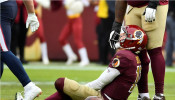 Washington Redskins quarterback Alex Smith (11) reacts after suffering a broken leg in the second half against the Houston Texans