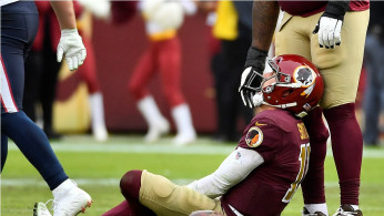 Washington Redskins quarterback Alex Smith (11) reacts after suffering a broken leg in the second half against the Houston Texans