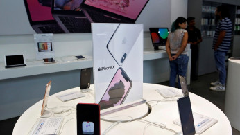 Apple iPhone X mobile phones are seen at an Apple reseller store in Mumbai