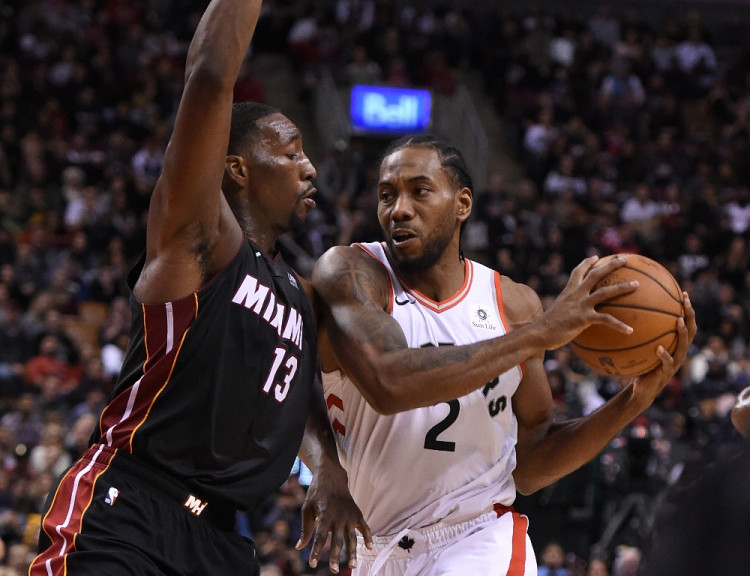 Toronto Raptors forward Kawhi Leonard and Miami Heat center Bam Adebayo (13) 