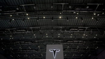 A Tesla sign is seen during the China International Import Expo (CIIE), at the National Exhibition and Convention Center in Shanghai