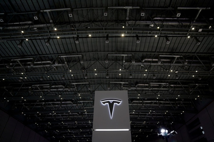 A Tesla sign is seen during the China International Import Expo (CIIE), at the National Exhibition and Convention Center in Shanghai