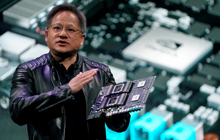 Jensen Huang, CEO of Nvidia, shows the Drive Pegasus robotaxi AI computer at his keynote address at CES in Las Vegas