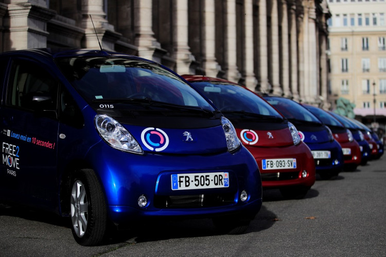 Free2Move Paris electric vehicles by Groupe PSA are displayed outside Paris city hall as the French car maker launches its free-floating car-sharing service in Paris